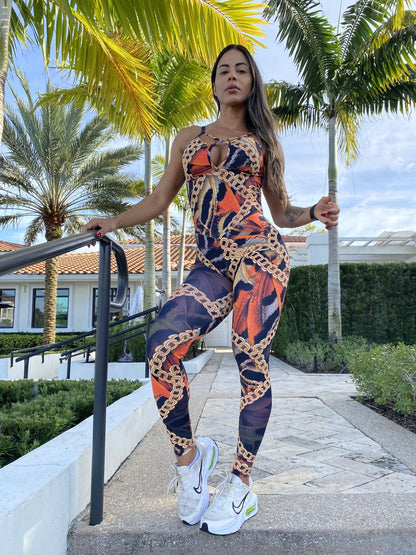 SCRUNCH BOOTY BLACK AND ORANGE AND GOLD CHAIN JUMPSUIT